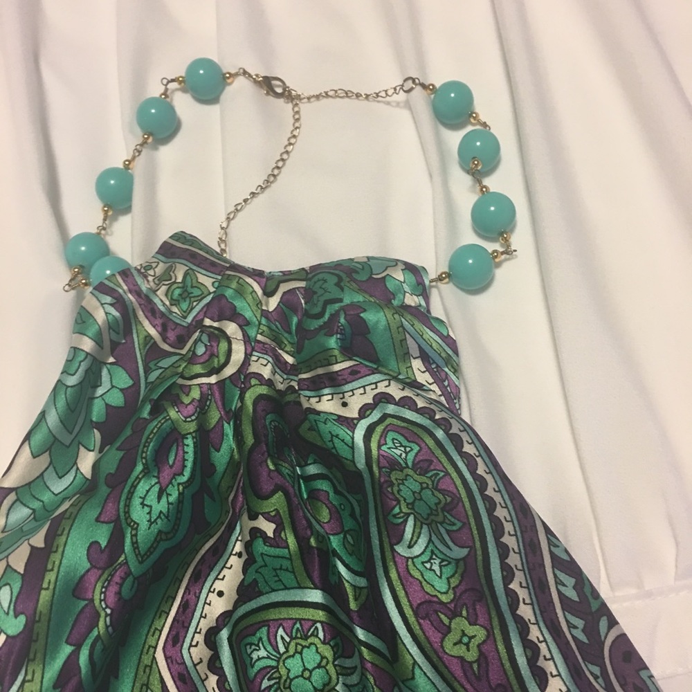 Halter top with jewels tie.  Fun and flattering.
